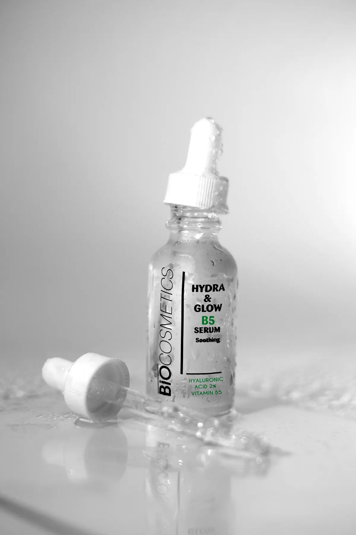 Hydrating serum bottle with glossy texture