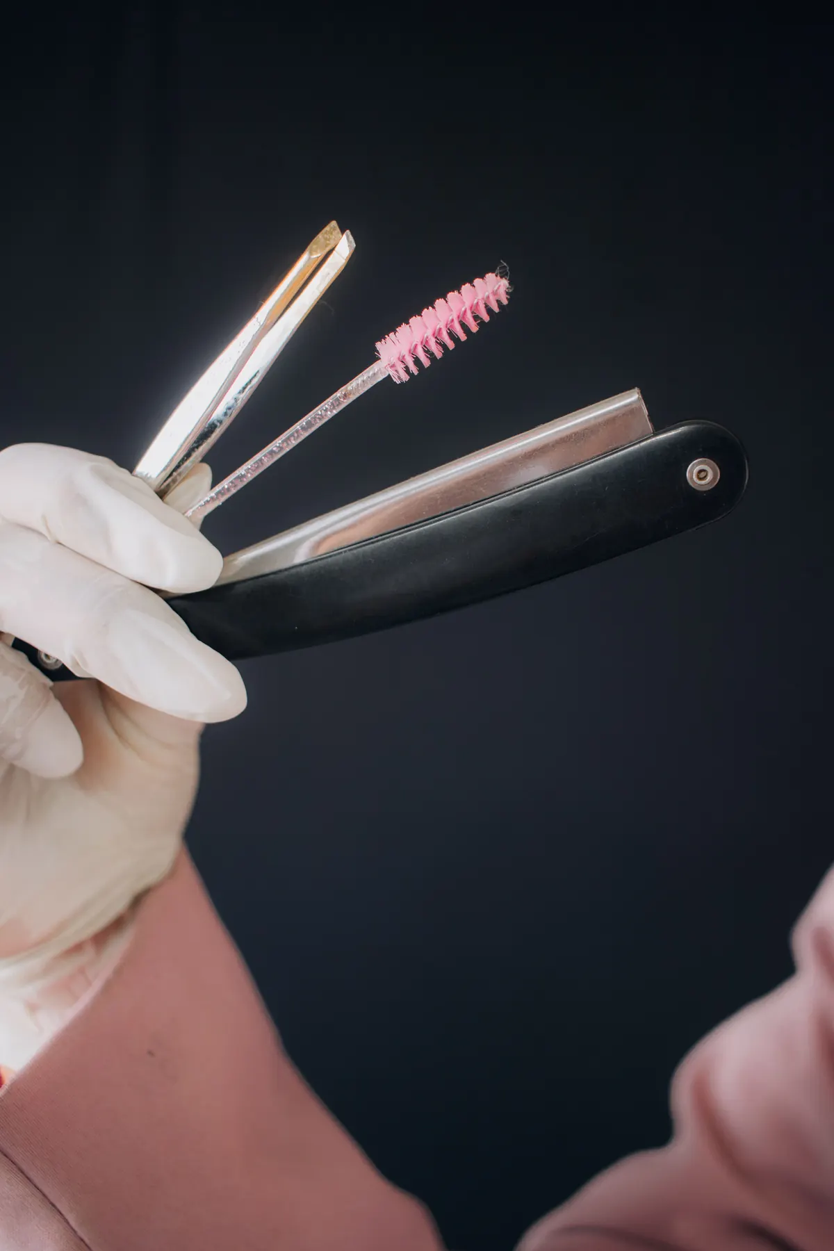 Close-up of precision dermaplaning wand and blade refill